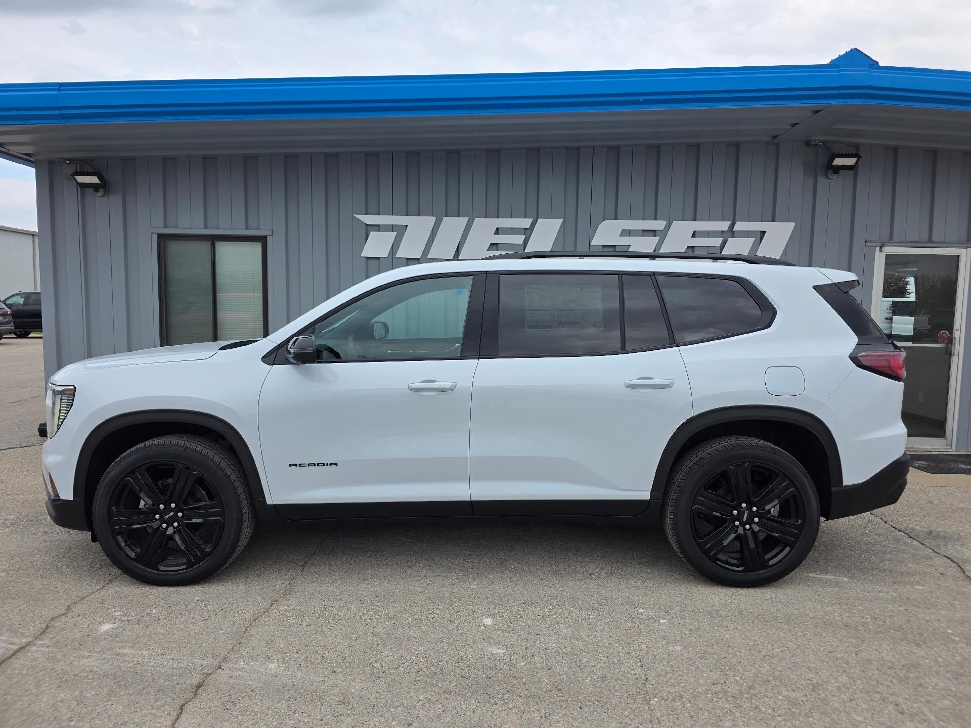2026 GMC Acadia Elevation in Glacier White Tricoat — front three-quarter view