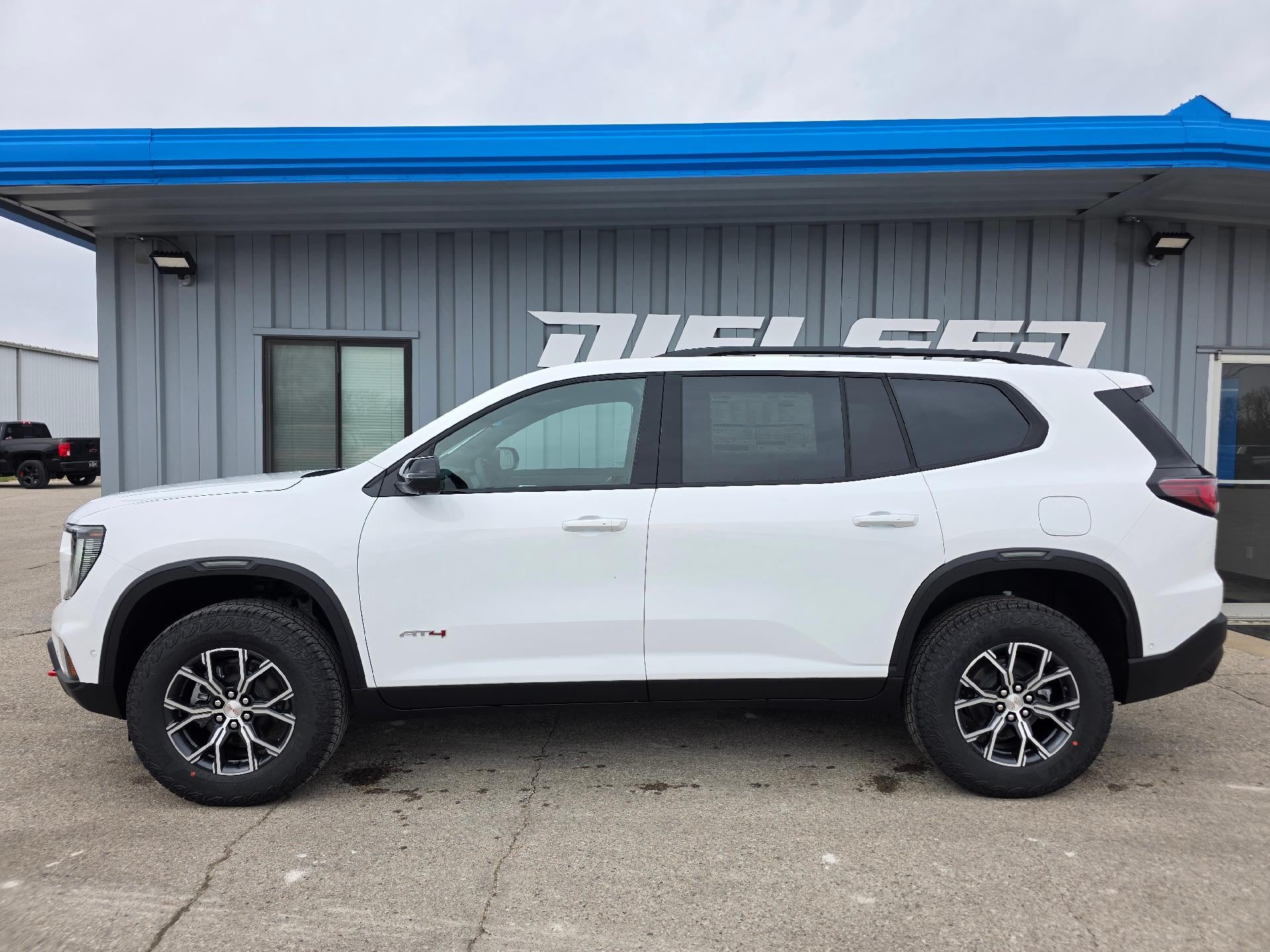 2026 GMC Acadia AT4 in Summit White — front three-quarter view