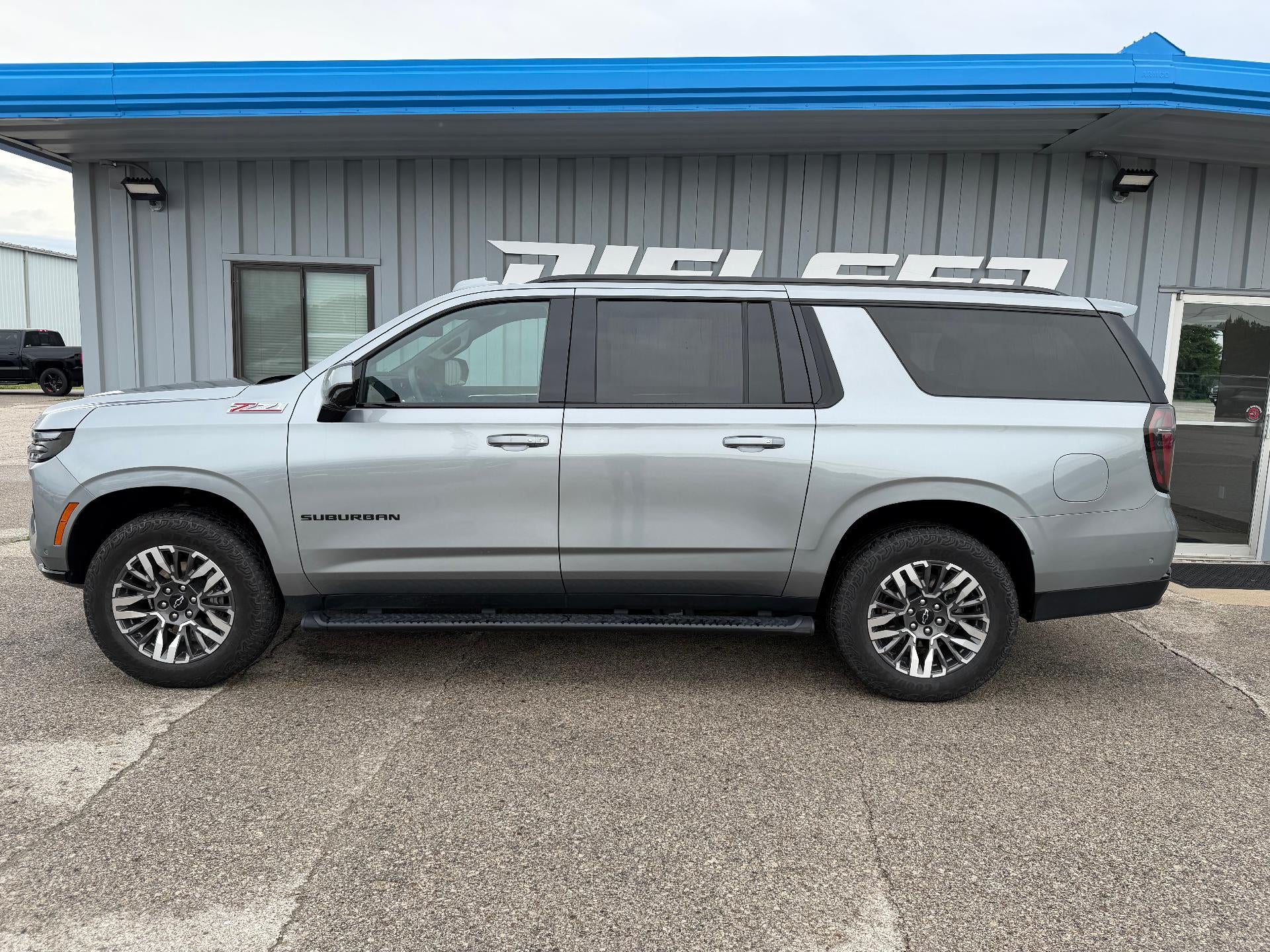 2025 Chevrolet Suburban Z71 in Sterling Gray Metallic — front three-quarter view