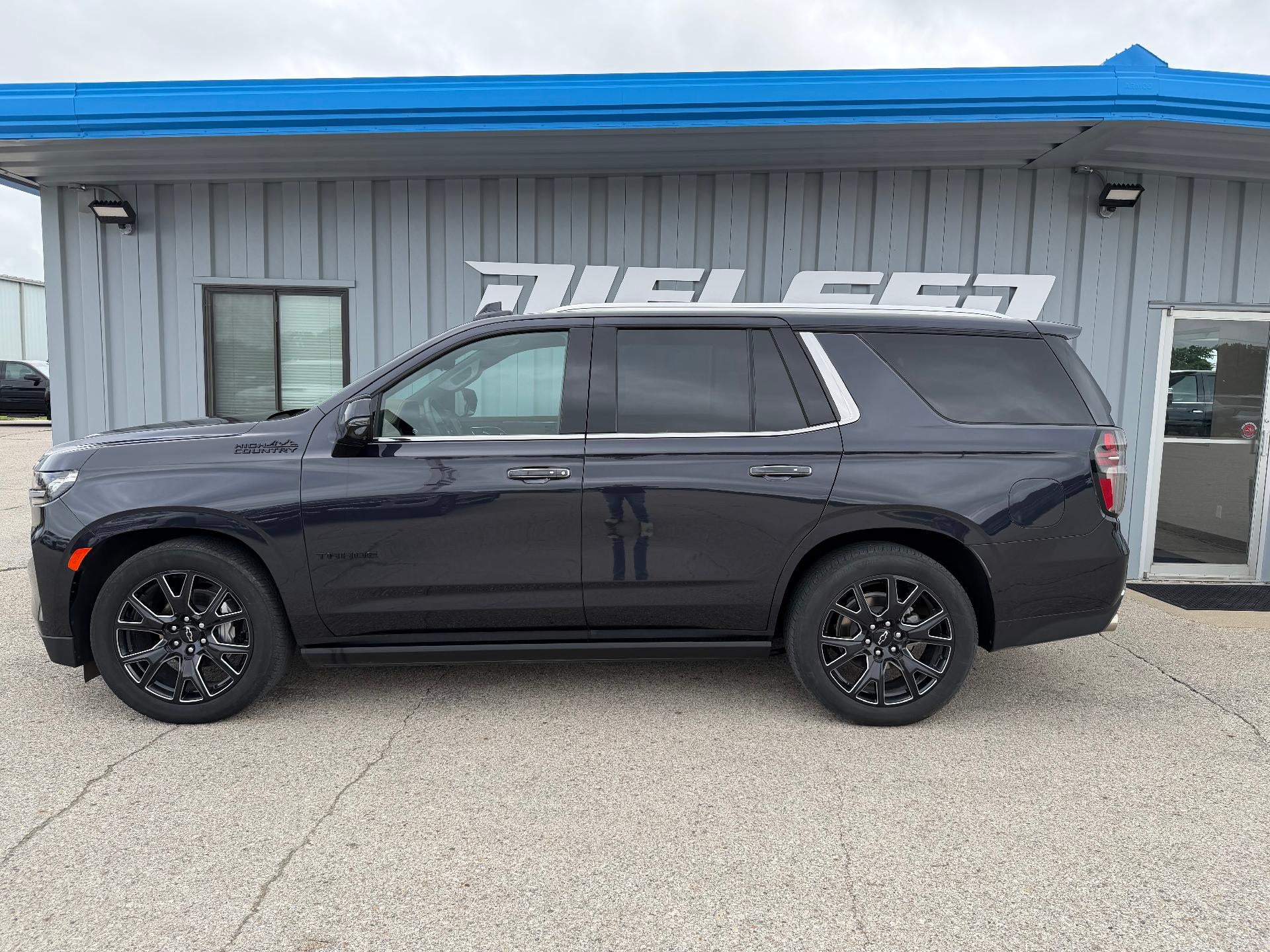 2024 Chevrolet Tahoe High Country in Dark Ash Metallic — front three-quarter view
