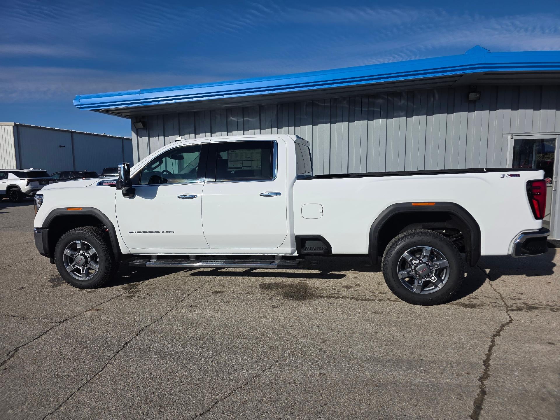 2026 GMC Sierra 2500 HD SLT in Summit White — front three-quarter view