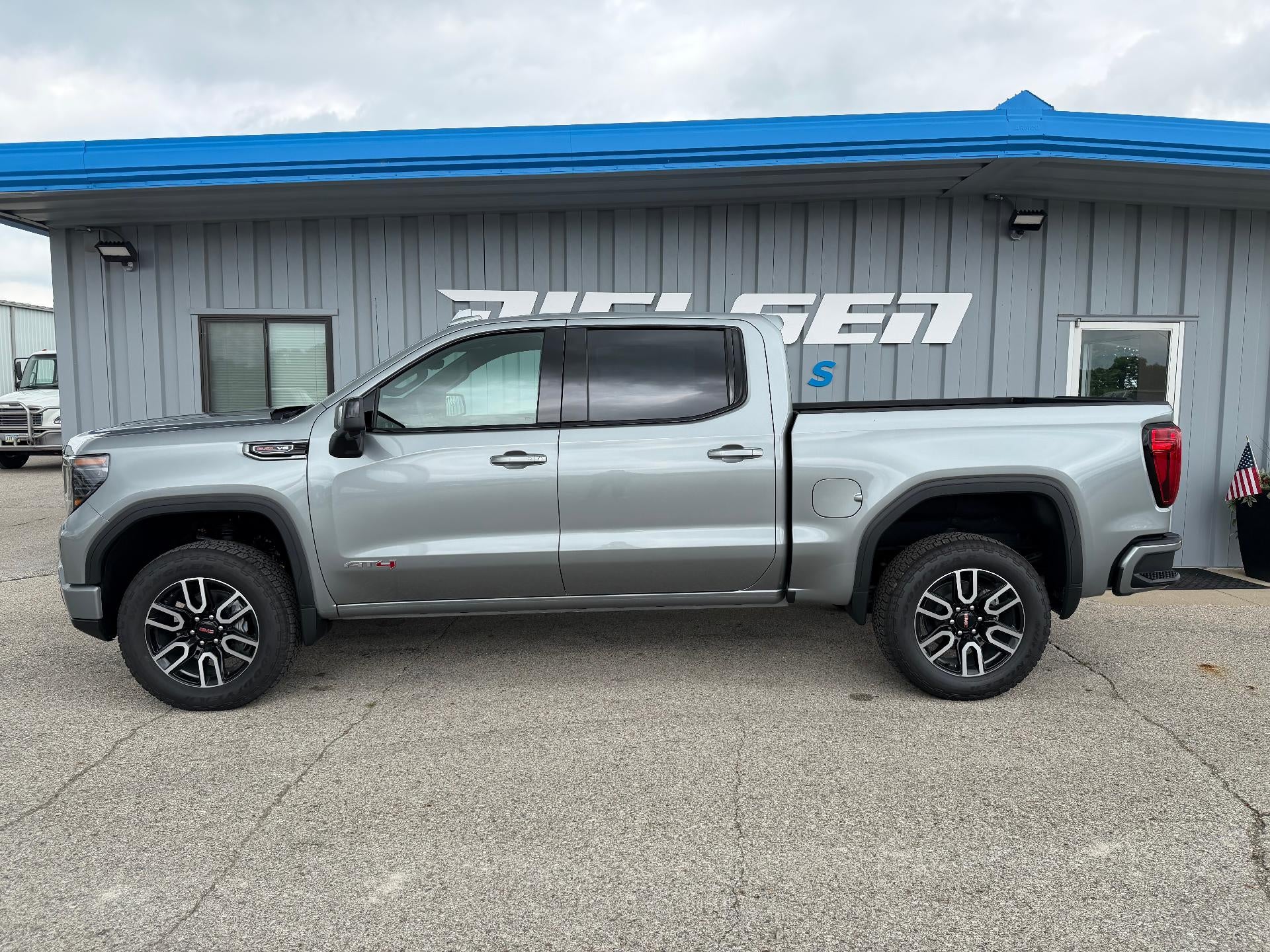 2026 GMC Sierra 1500 AT4 in Sterling Metallic — front three-quarter view