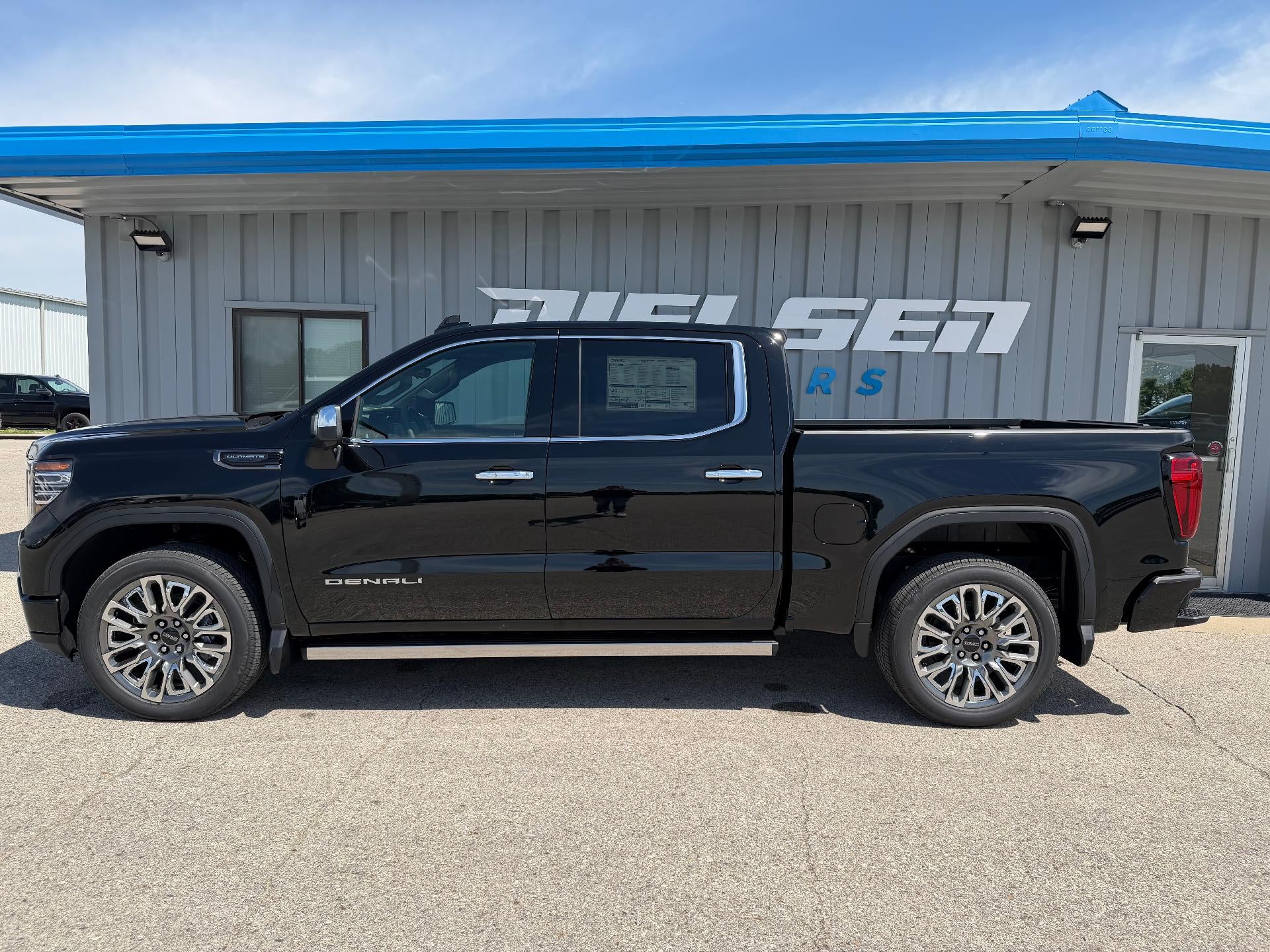 2026 GMC Sierra 1500 Denali Ultimate in Onyx Black — front three-quarter view