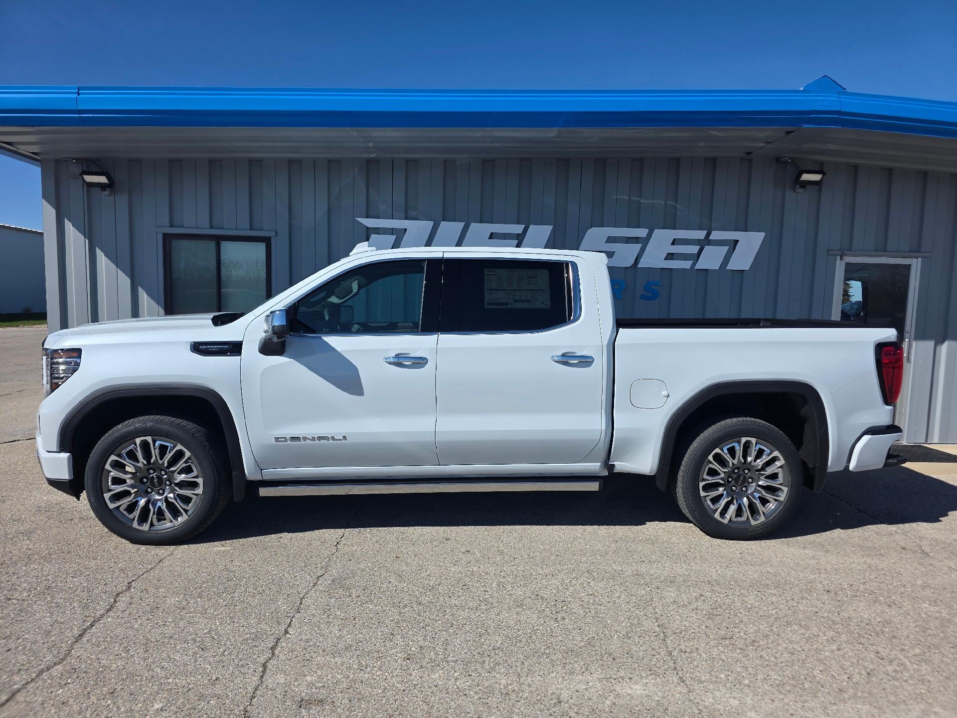 2026 GMC Sierra 1500 Denali Ultimate in Glacier White Tricoat — front three-quarter view