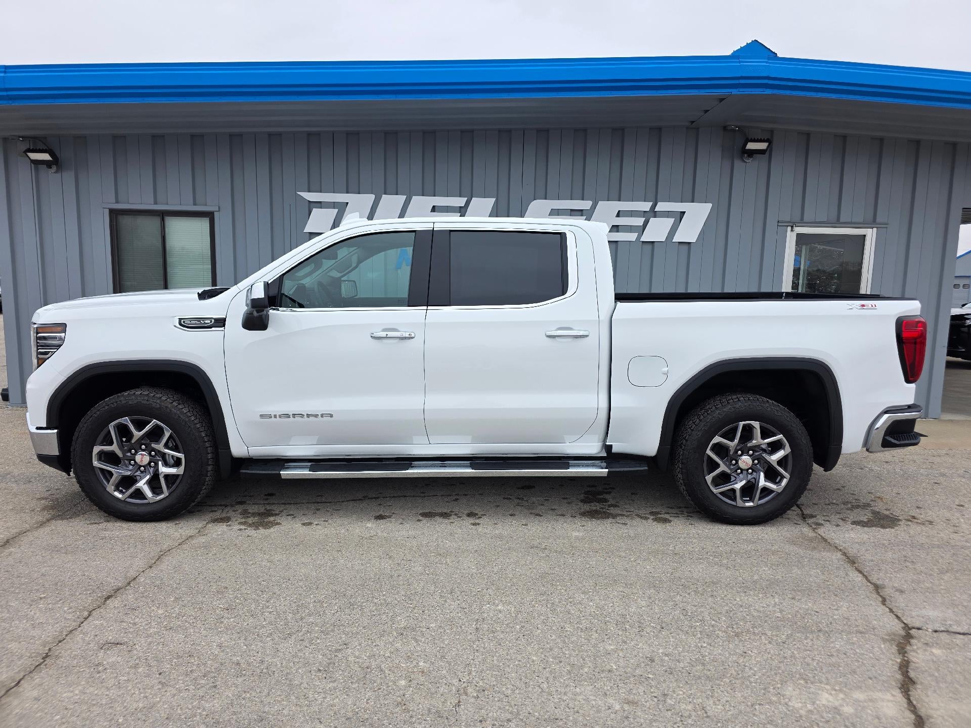 2026 GMC Sierra 1500 SLT in Summit White — front three-quarter view